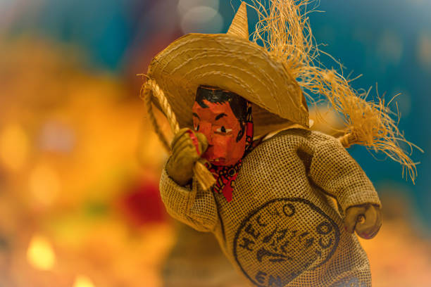 Cabo San Lucas, Mexico - December 25, 2023: A Mexican man sells crafts along the Playa Pública public beach at the resort city of Cabo San Lucas, Mexico. Cabo San Lucas, a resort city on the southern tip of Mexico’s Baja California peninsula, is known for its beaches, water-based activities and nightlife.