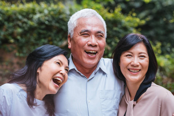 istock Group of seniors enjoying discussion at park 1157708173