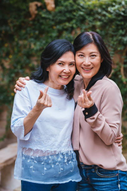 istock Happy women hugging with joy in cafe 1157708192