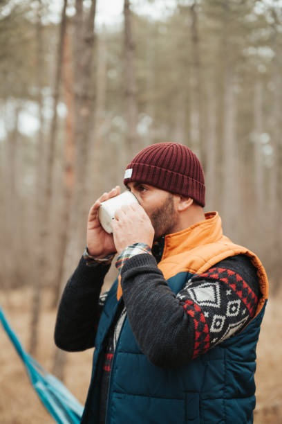 istock Hiker man drinking, outdoor camping 1157711339