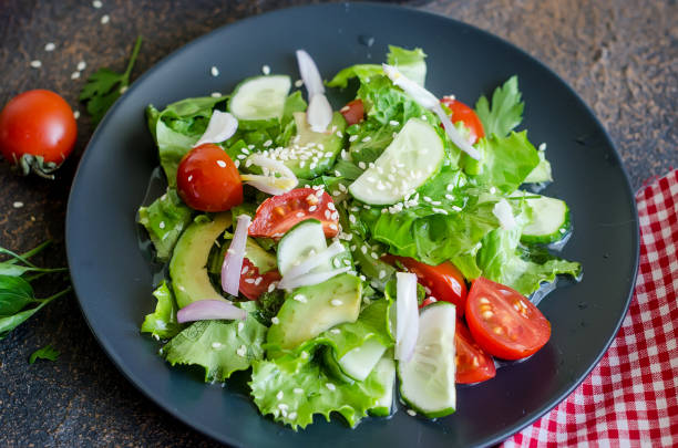 istock Salad with vegetables, greens and sesame 1157713856