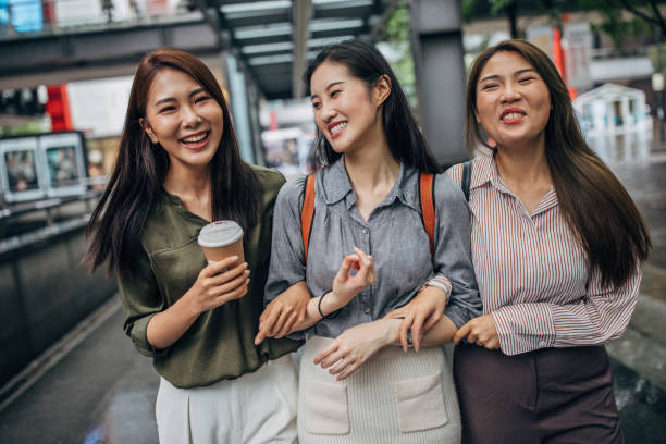 istock Three young women walking in the city 1157714887