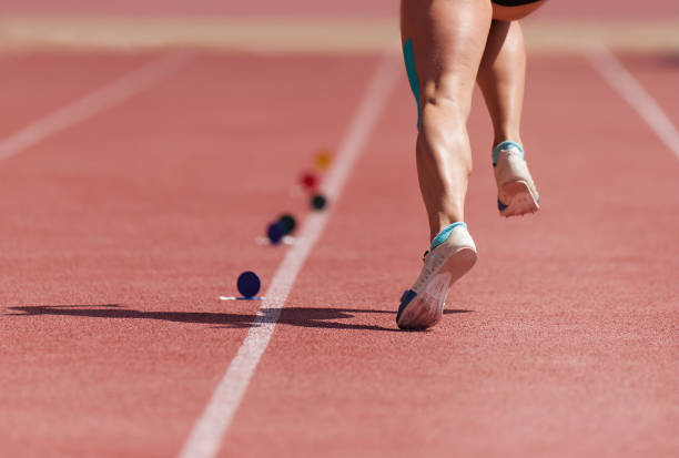 istock Running on track athlete to compete in long jump 1157716853