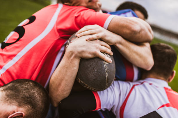 istock Close up of unrecognizable athletes during rugby match. 1157718790