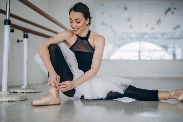 istock Young Woman Preparing for Ballet Training 1157719768