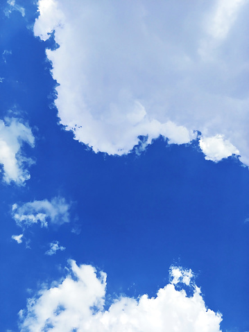 clouds on bright deep blue sky