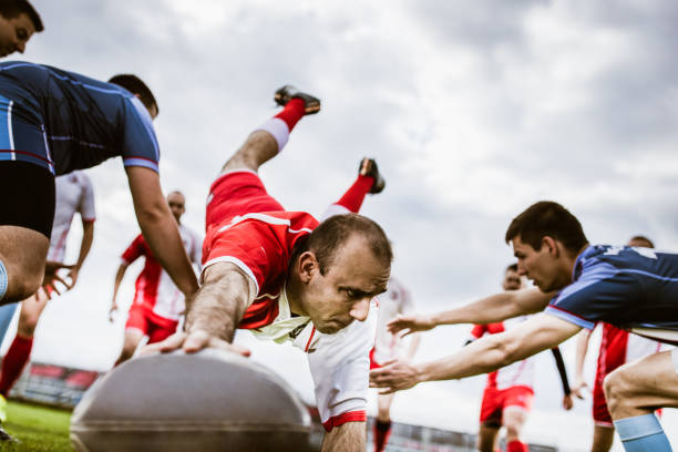 istock Determined player scoring touchdown on a rugby match at playing field. 1157721745