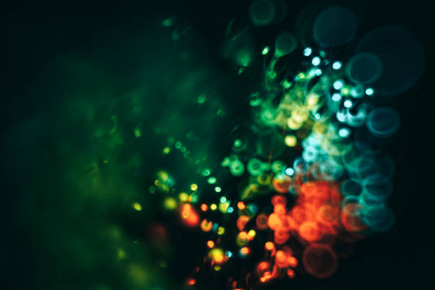 istock Beautiful colored bokeh on a dark abstract background. 1157721783