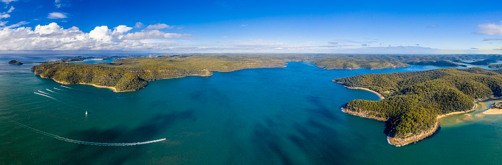 A view of the Hawkesbury river from the Central Coast, looking towards Sydney, West Head, with Patonga to the right, and clouds to the left.