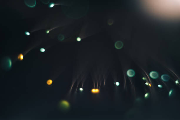 istock Beautiful colored bokeh on a dark abstract background. 1157722684