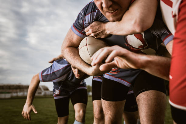 istock Gripping through defensive players on rugby match! 1157722866