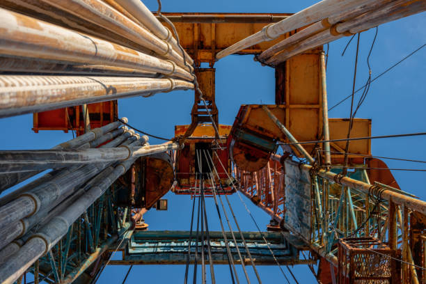 Oil drilling rig operation on the oil platform in oil and gas industry. Industrial concept. Toned Oil drilling rig operation on the oil platform in oil and gas industry. Industrial concept. Toned. oil well stock pictures, royalty-free photos & images