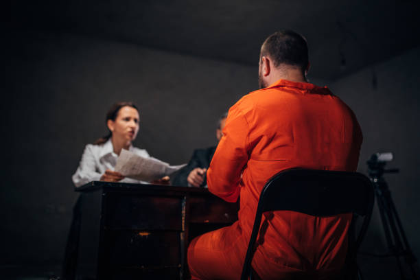 istock Prisoner and female detective 1157726271