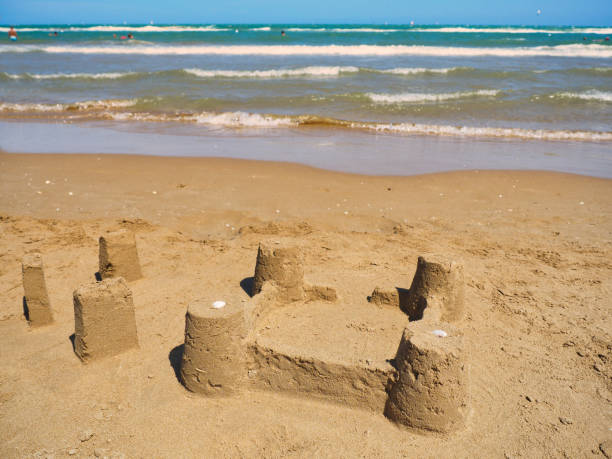 istock Sand castle or sandcastle on the beach at sea 1157727151