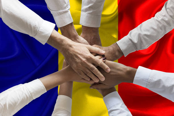 istock Union or Team Hands multcultural people team over romanian flag topview 1157727179