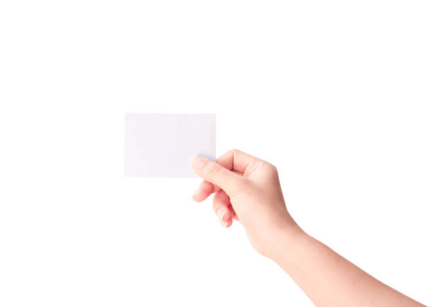 istock Woman hand holding paper isolated on white background 1157727475