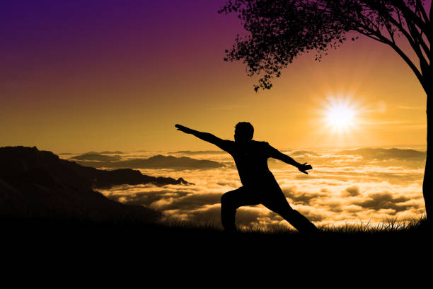 istock silhouette elderly obese men doing yoga on the mountain 1157727844