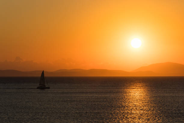 istock Lonely yacht at sea during sunrise. 1157730162