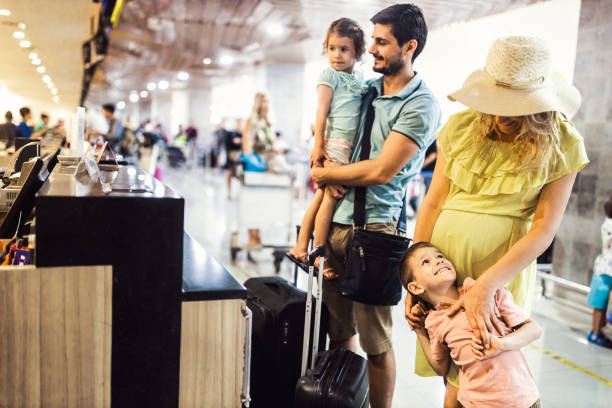 istock Young family checking their begs at airport terminal. 1157731498