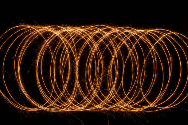 istock Sparkle golden glowing shiny spiral lines and circle light effect. Abstract Glowing light fire ring trace. 1157737534
