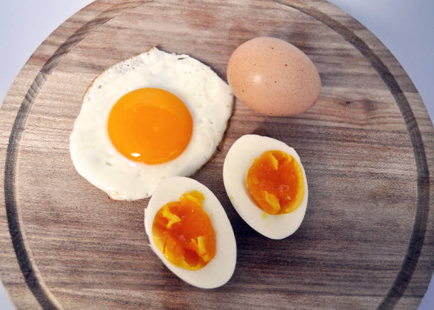 istock different types of eggs - raw, inshell, boiled, fried on a wooden background 1157737895