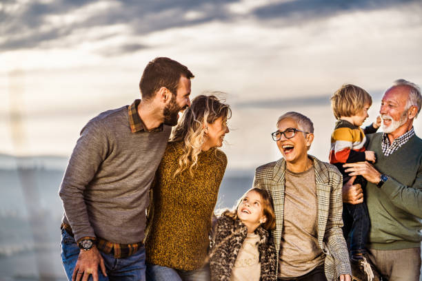 istock Cheerful multi-generation family talking while taking a walk outdoors. 1157738093