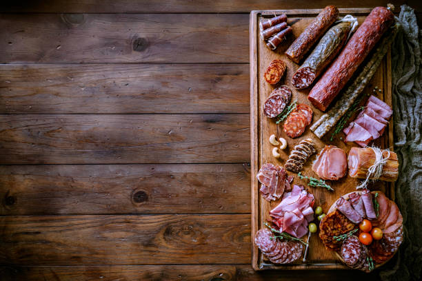 istock Tapas of cured ham and cheese delicious appetizer on rustic wood table with copy space 1157739829