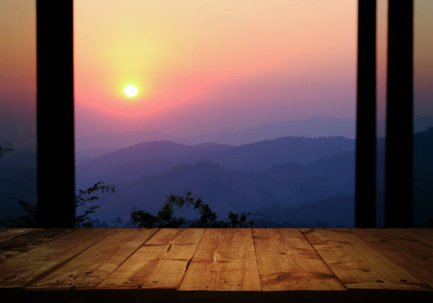 istock wooden table with Morning sunrise 1157739947