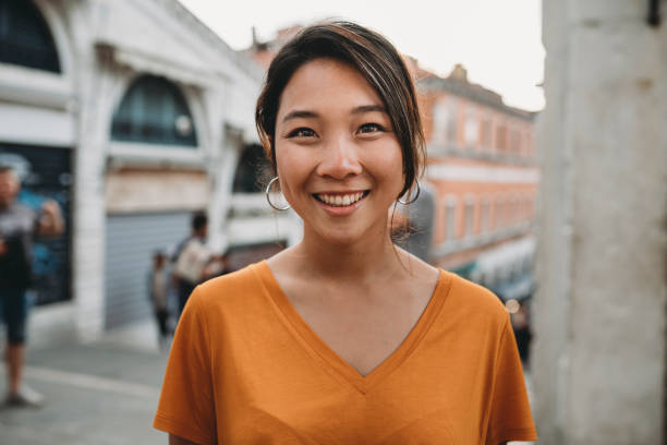 portrait of a young adult asian woman in venice - casual shirt imagens e fotografias de stock