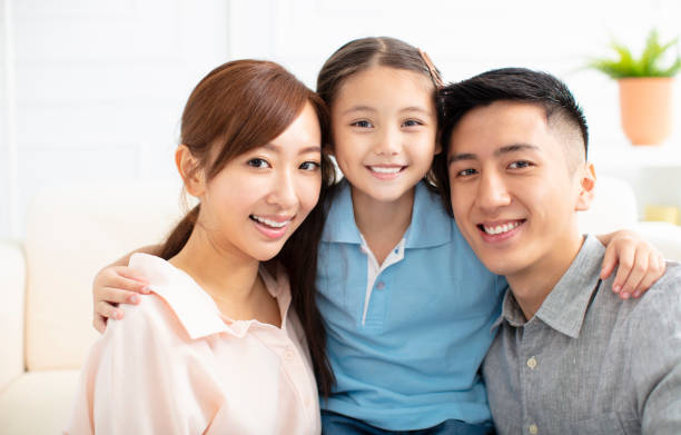istock Happy parents and child having fun together 1157742546