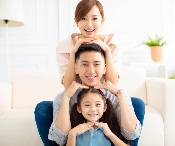 istock Happy parents and child having fun together 1157742571