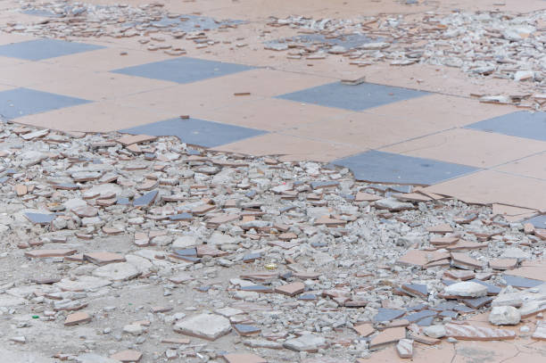 istock Broken tiles sidewalk with crushed fragments 1157744067