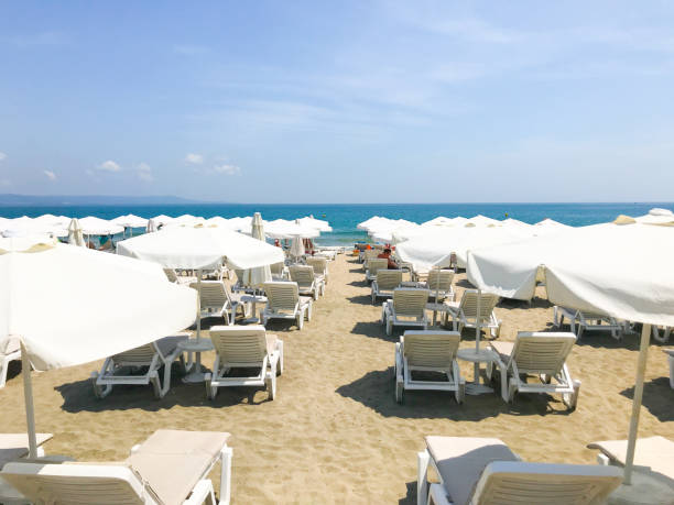 istock White Loungers And Umbrellas 1157745924