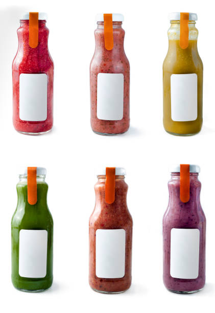 istock Set with color smothies in glass bottles with copy space on white background, mock-up 1157747447