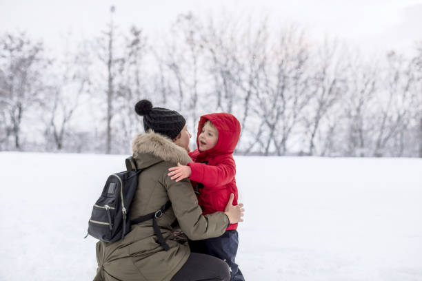 istock Mother and son on a snow 1157747493