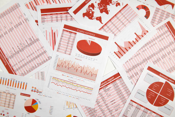 istock Business reports, data tables and charts - directly above view of office table workspace. 1157747770