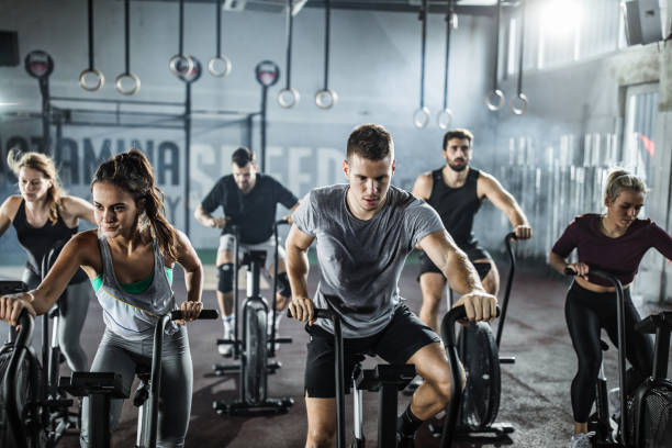 istock gym training on stationary bikes! 1157748397