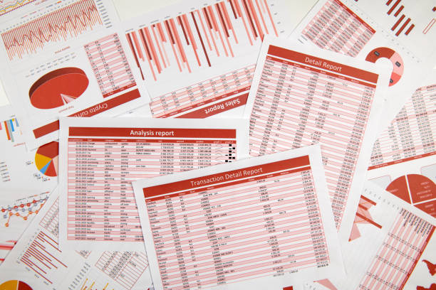 istock Business reports, data tables and charts - directly above view of office table workspace. 1157748500