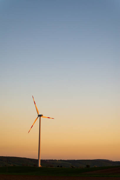 istock Windmills for electric power production at sunset 1157750197