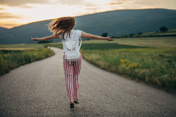 istock Woman with hands raised in the nature 1157750223