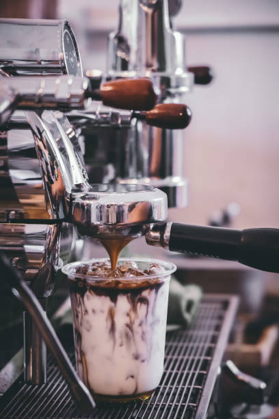 istock Coffee machine making drink in a cafe, The milk cup is placed on the coffee base. 1157752710