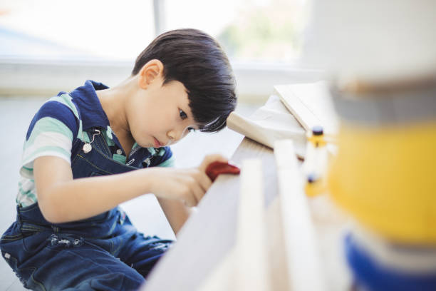 istock Concept of engineering and technicians - The boy is using the tools and equipment to measure the engineers intently and confidently. 1157753099