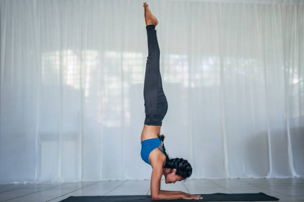 istock Woman Doing Yoga 1157754962