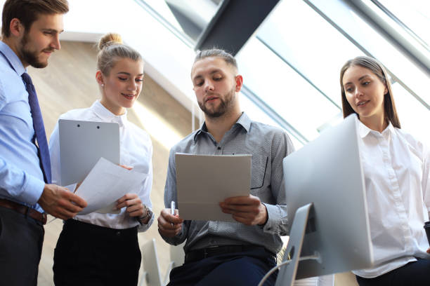 istock Business partners discussing documents and ideas at meeting. 1157755035