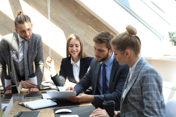 istock Business partners discussing documents and ideas at meeting. 1157755256