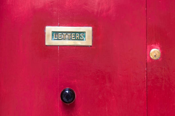 istock Letterbox with a red door door knob background. 1157755718