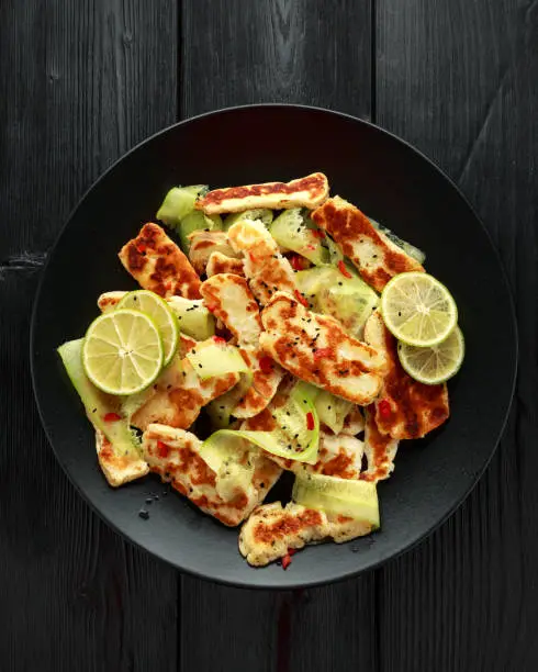 Pan-seared halloumi cheese and sweet cherry tomatoes salad.