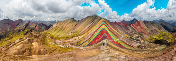 Hiking scene in Vinicunca, Cusco Region, Peru.  Rainbow Mountain Hiking scene in Vinicunca, Cusco Region, Peru.  Rainbow Mountain (Montana de Siete Colores). peru travel stock pictures, royalty-free photos & images