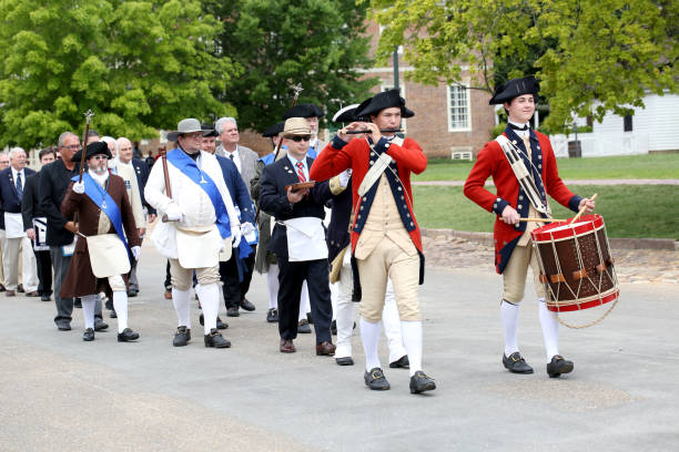 Williamsburg, Virginia: June 22, 2019 USA:  Along Duke of Glocester street in Colonial Williamsburg the fife and drums march along in the early morning.