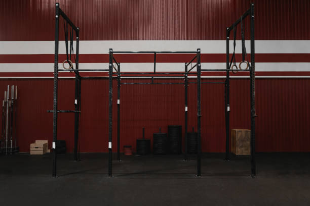 istock gym with workout equipment. Horizontal bars, gymnastic rings. 1157765285